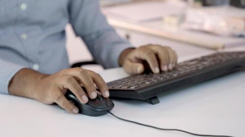 Man using mouse and keyboard