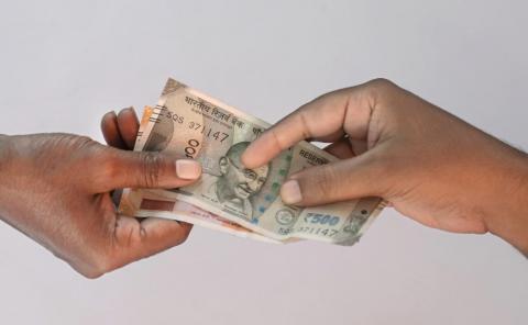 Paying Indian rupee