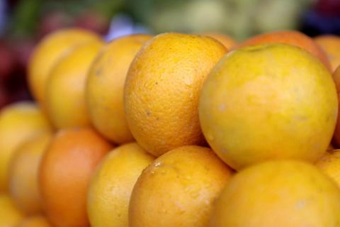 Stack of fresh orange fruits
