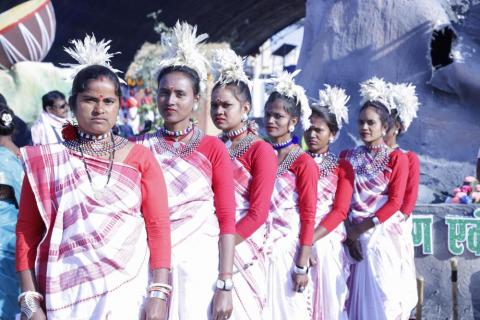 Female artist ready to perform wearing white dress
