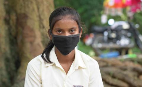 Female student wearing black mask